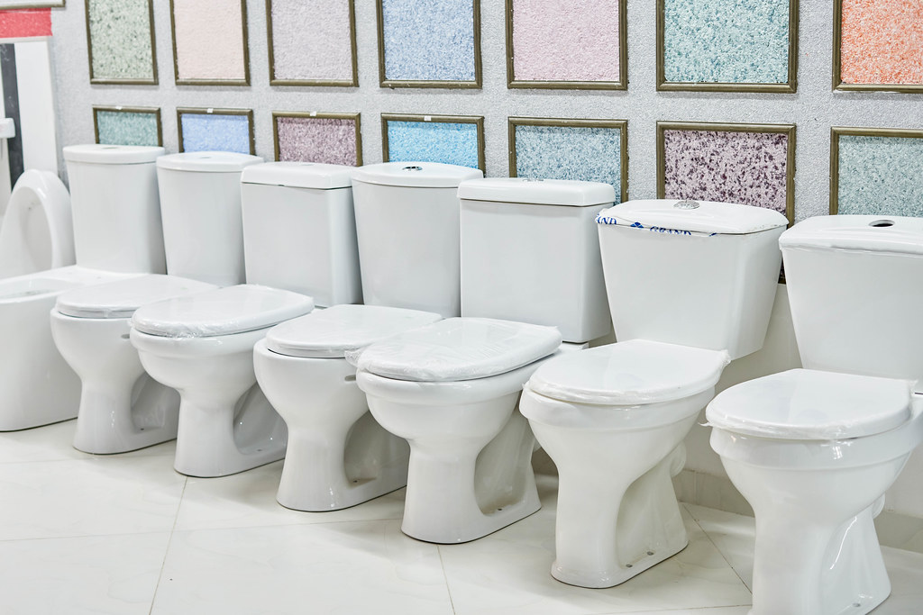 Variety of toilet bowls in construction store