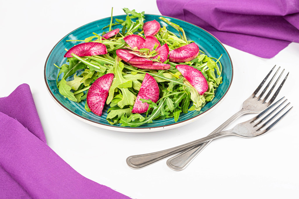 Vegetarian salad with fresh arugula and radish