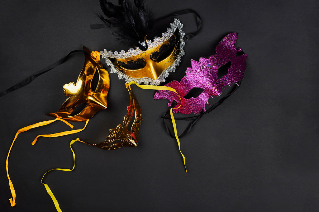 Venetian masks on dark background ready for carnival party
