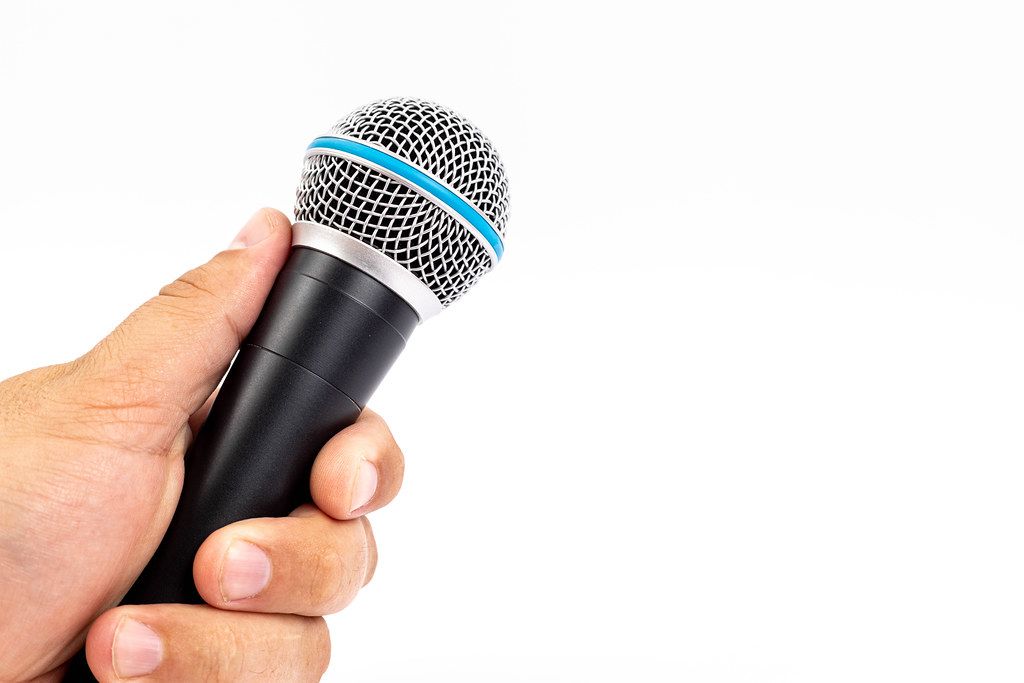 Vocal Singing Microphone in the hand with white background