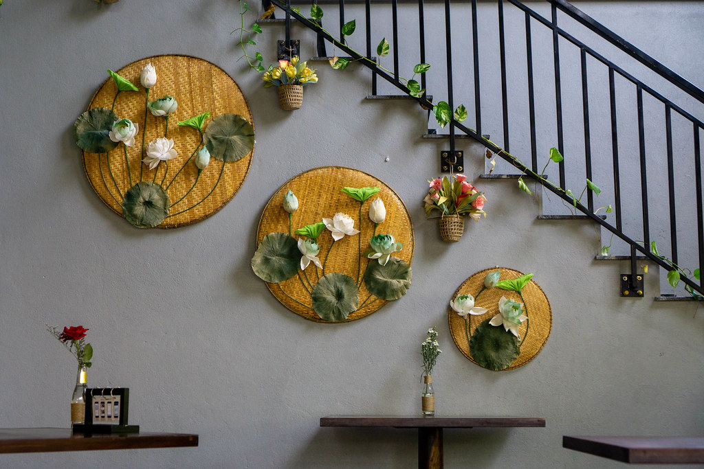 Wall Decorations with Flowers on Bamboo Boards and Basket Plant Pots inside a modern Vietnamese Restaurant