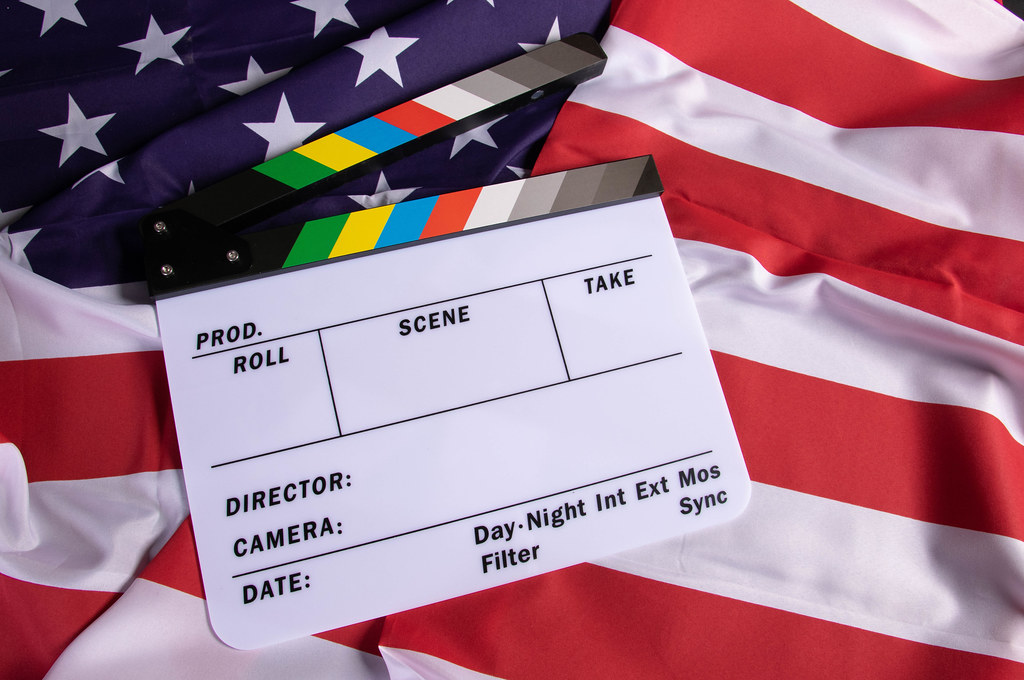 White movie clapper on a flag of United States of America