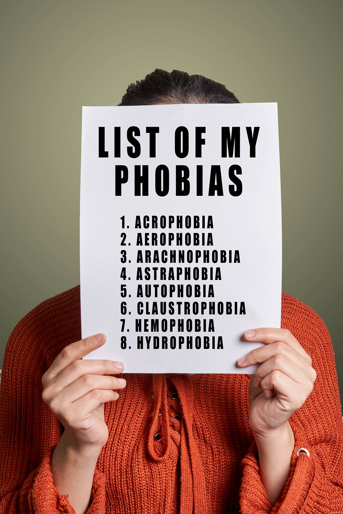 Woman holds a list of phobias