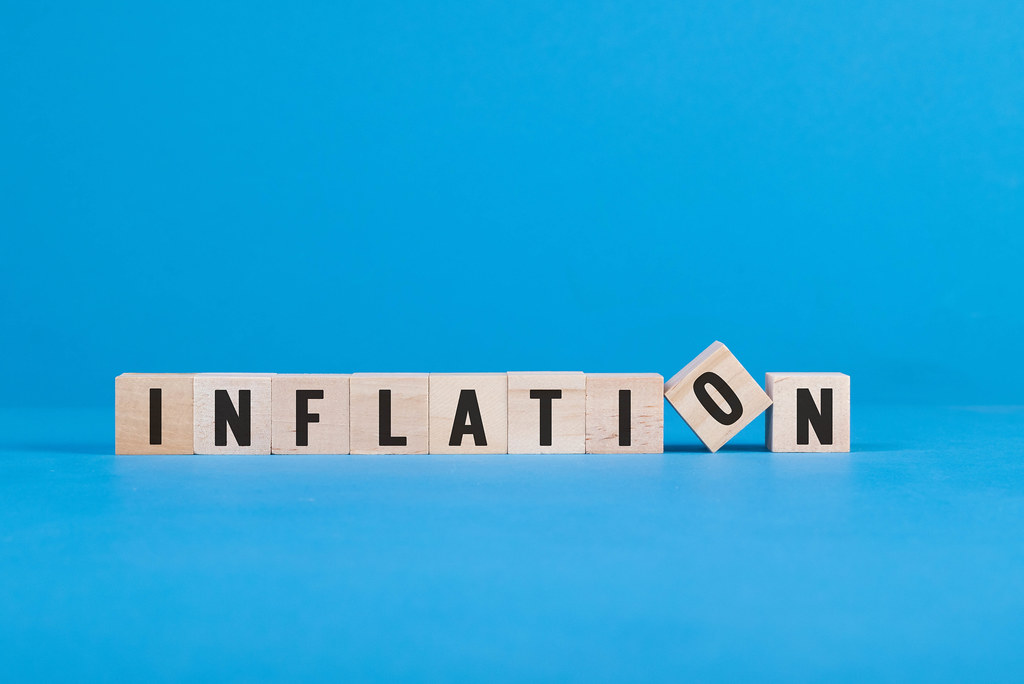 Wooden blocks with Inflation text on blue background