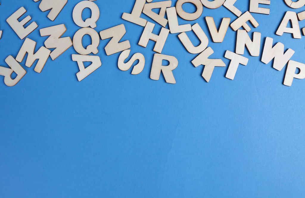 Wooden letters on blue background
