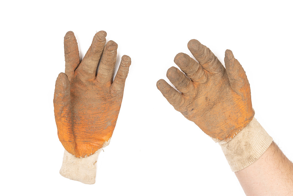 Work Gloves on the hand isolated above white background