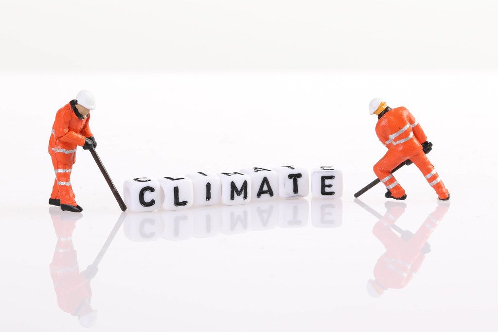 Workers figures with Climate text
