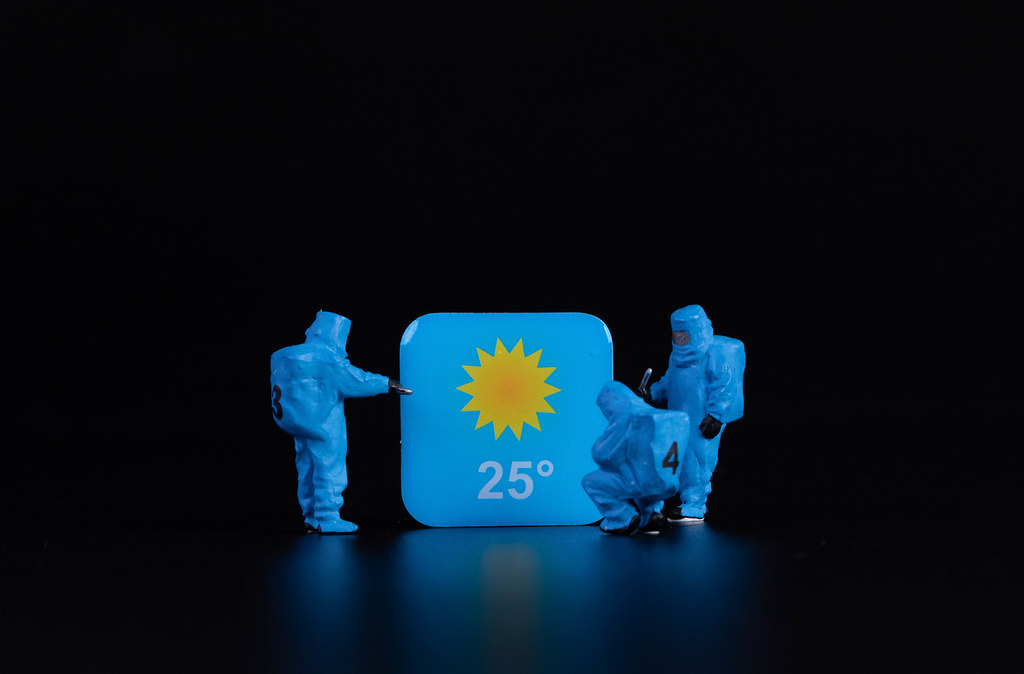 Workers in protective clothes with weather app symbol