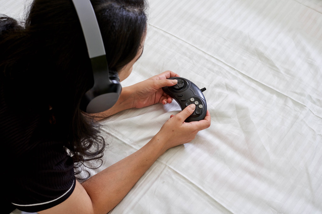 Young gamer girl in enjoys playing online games