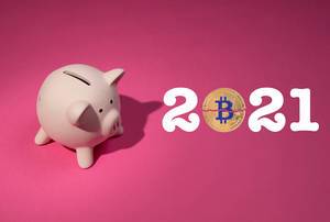 2021 text with Bitcoin and piggy bank on pink background