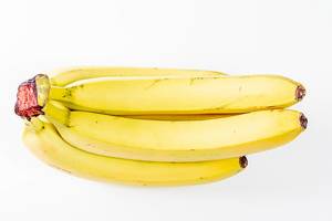 A branch of ripe bananas on a white background (Flip 2020)