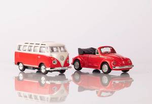 A classic red minibus and red beetle car (Flip 2019)