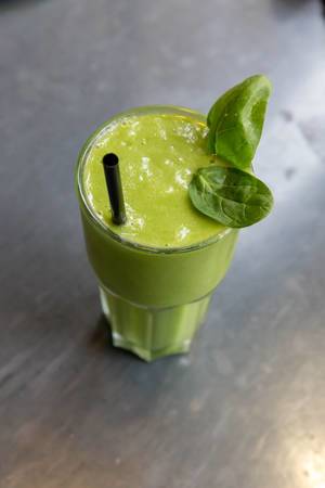 A green detox smoothie with spinach, basil and ginger