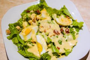 A healthy egg salad plate with creamy sauce