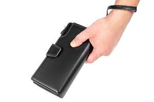 A man holds a black wallet in his hand (Flip 2020)