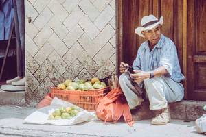 A Man Selling Mandarins