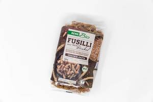 A package of organic wholemeal spelt fusilli by Rewe Bio on white background