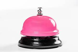 A service pink bell for hotel on white background (Flip 2019)