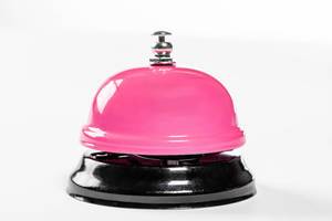 A service pink bell for hotel on white background