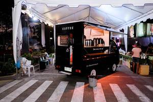 A small coffee store on wheels at a food park