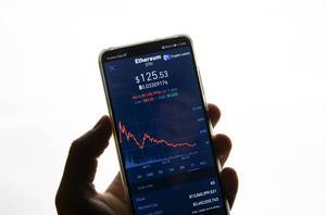 A smartphone displays the Ethereum market value on the stock exchange