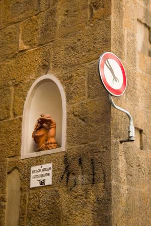 A street sign created by Clet Abraham in Florence, Italy