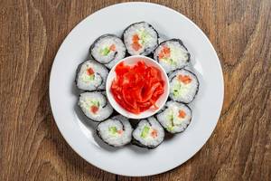 A top view of a plate of Maki rolls and pickled pink ginger (Flip 2019)