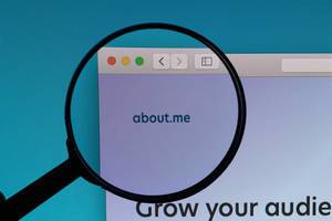 About.me logo under magnifying glass