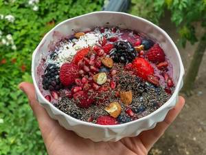 Acai Bowl with raspberry, strawberry, blackberry, pomegranate, almond and chia