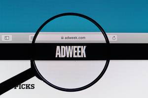 Adweek logo under magnifying glass