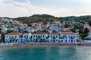 Aerial view of cubic houses in Kounoupitsa, Spetses, at the coastal path of the Argolic Golf