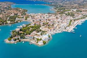 Aerial view of greek houses at a headland in the blue bay and Porto Heli Marine