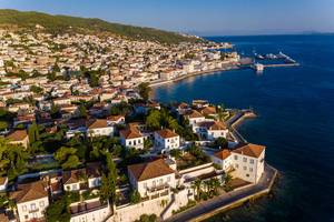 Aerial view of the picturesque island Spetses with aristocratic, neoclassical, Greek houses in the Argolic Gulf