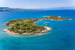 Aerial view of yachts in a bay of the tiny Island Chinitsa Nisi, in the Myrtoan Sea in Greece