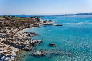 Aerial view shows the granite rocks in a small bay at the beach Kolimbithres on Paros, Greece, with the blue sea