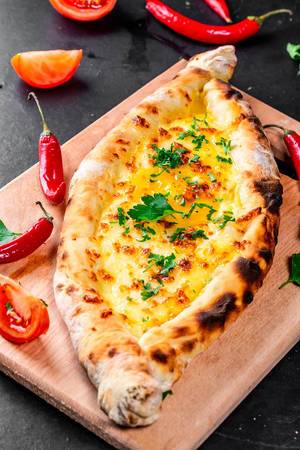 Ajarian open khachapuri with chicken egg and cheese