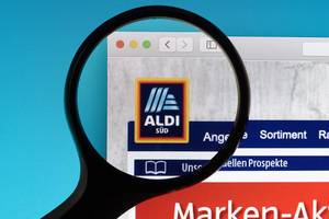 Aldi Süd logo under magnifying glass