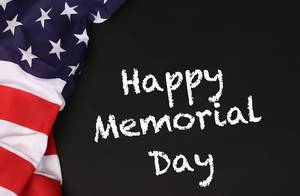 American flag with the text Happy Memorial Day against a blackboard background
