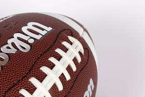 American football ball on white background