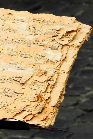 An old music notebook used by a street musician in Rome, Italy