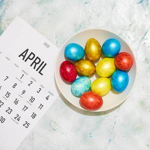 April calendar and a plate of Easter eggs