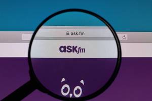 ASKfm logo under magnifying glass