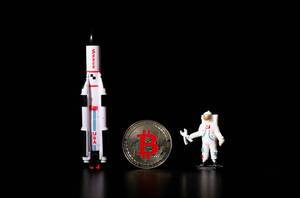 Astronaut and space ship with silver Bitcoin