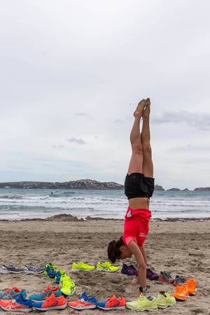 Athletic girl doing a handstand
