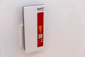 AVM FRITZ! WLAN Repeater 1750E in a power socket, increases the range of the WLAN network at home