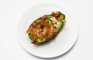 Avocado baked with egg and bacon
