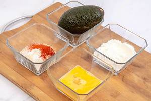 Avocado Flour Eggs and Breadcrumbs with Paprika on the wooden board