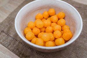 Background Of Extruded Puff Cheese Balls From Above