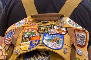 Backpack with different patches of cities and countries