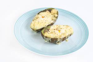 Baked Avocado with eggs and grated cheese